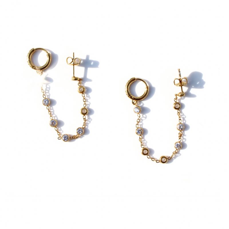 Gold plated double piercing earrings with clear crystal and pearl bead chain connecting stud to huggie hoop