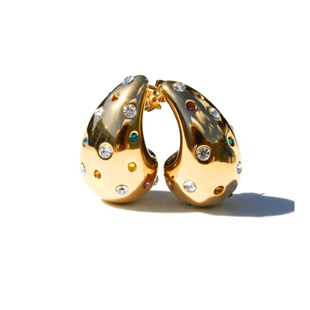 Gold stud earrings with embedded colorful gemstones on a white background