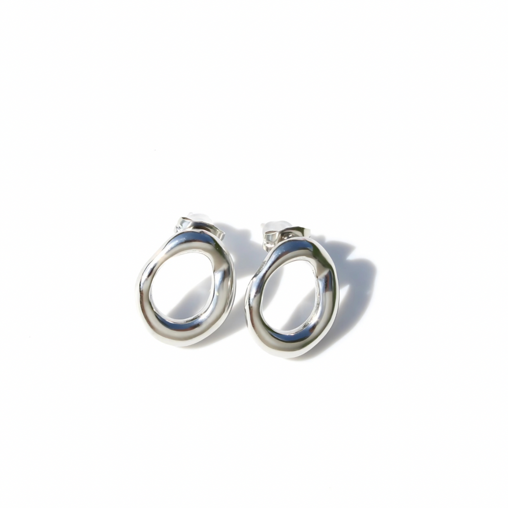 Pair of silver earrings on a white background