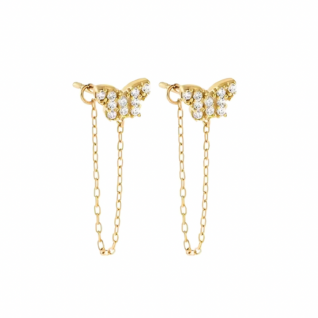 Gold butterfly earrings with chain details on a white background