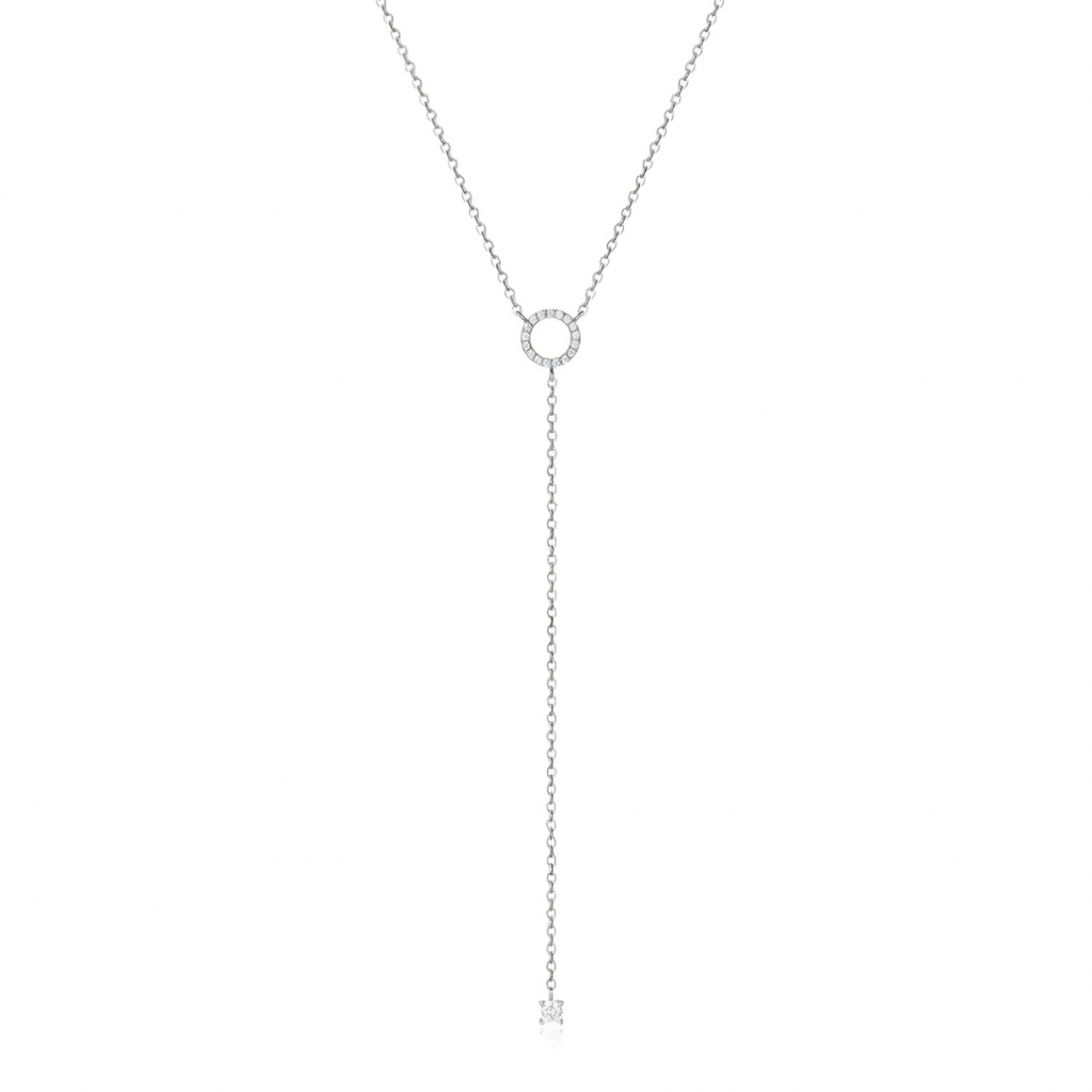 Delicate silver necklace with a small round pendant on a white background