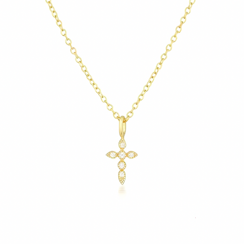 Gold cross necklace on a white background